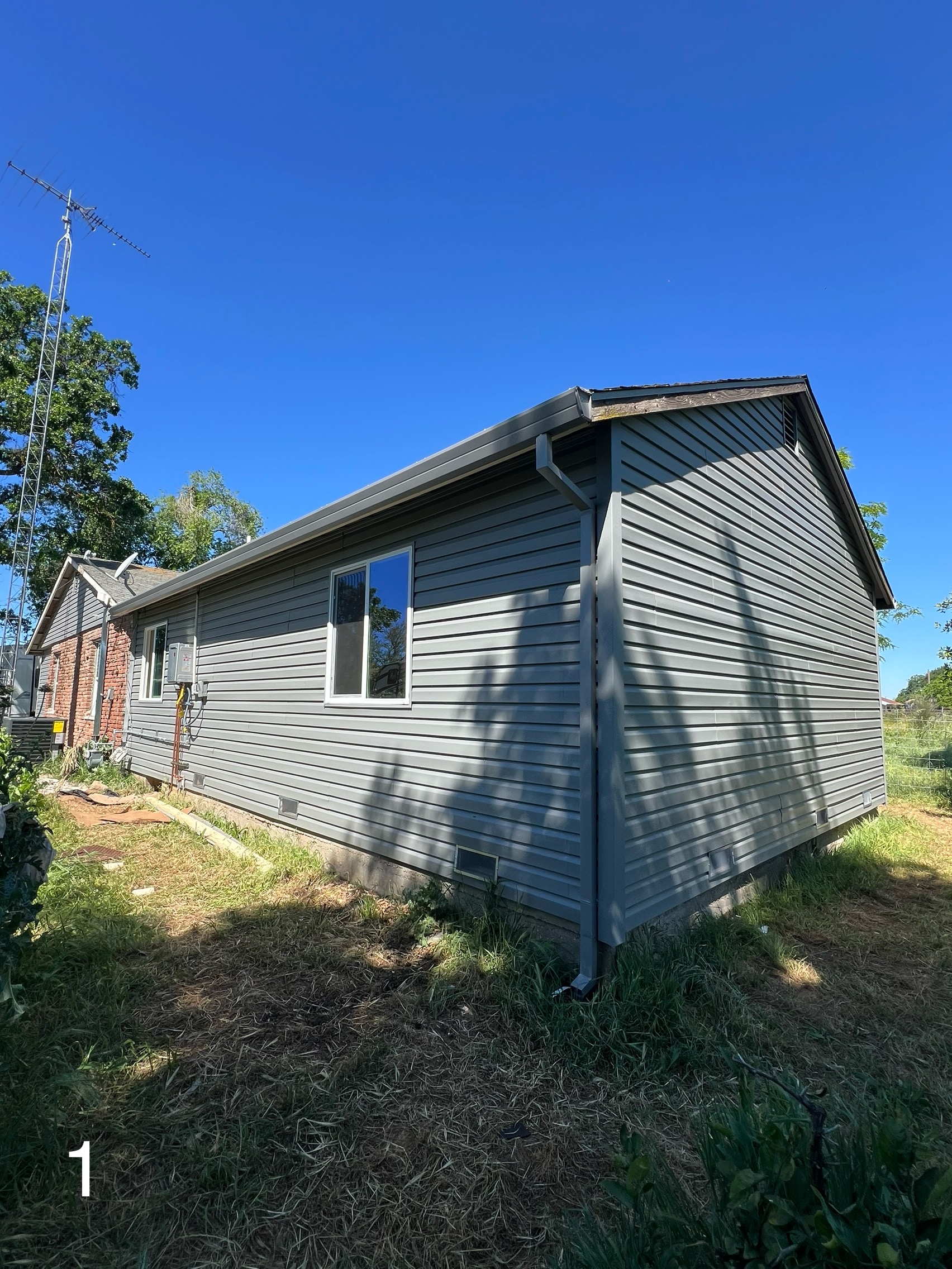 After: New vinyl siding installed on the side elevation of the Yuba City home