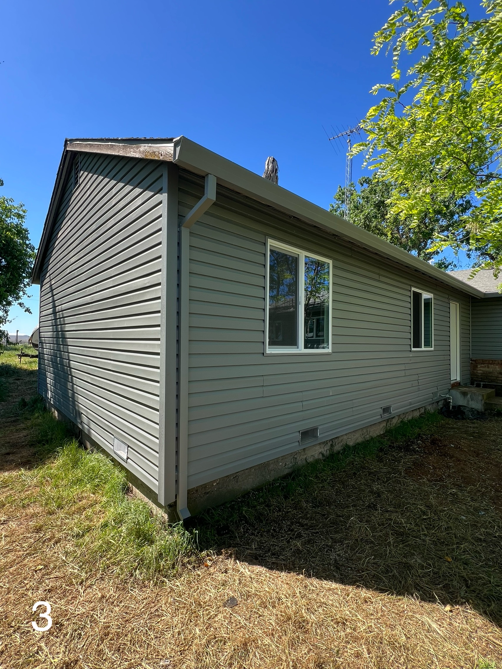After: New vinyl siding on the side and rear corner of the Yuba City home