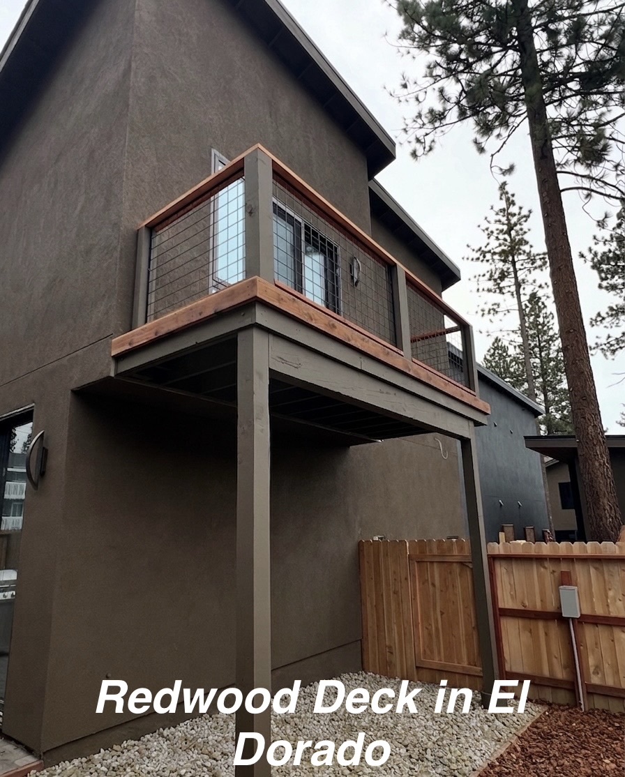 Custom redwood deck construction with cable railing on a home in El Dorado, California by Pacifex Siding