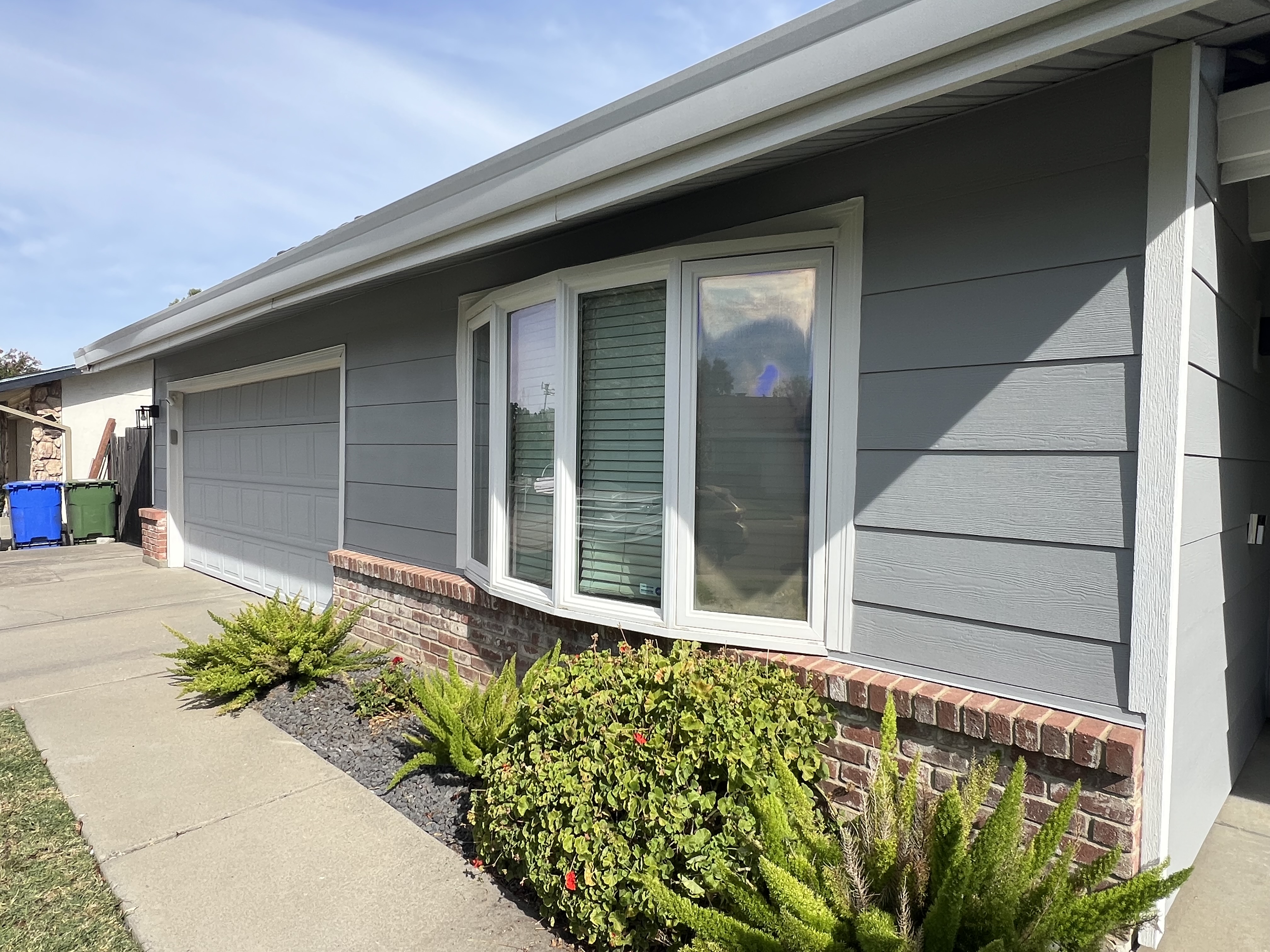 Gray James Hardie horizontal lap siding with white trim