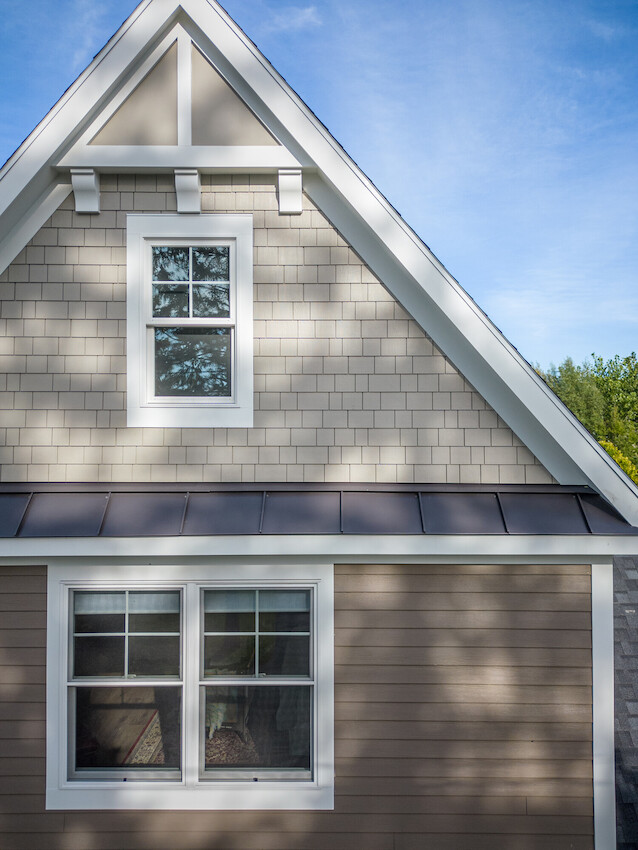 Home combining James Hardie shingle and horizontal lap siding